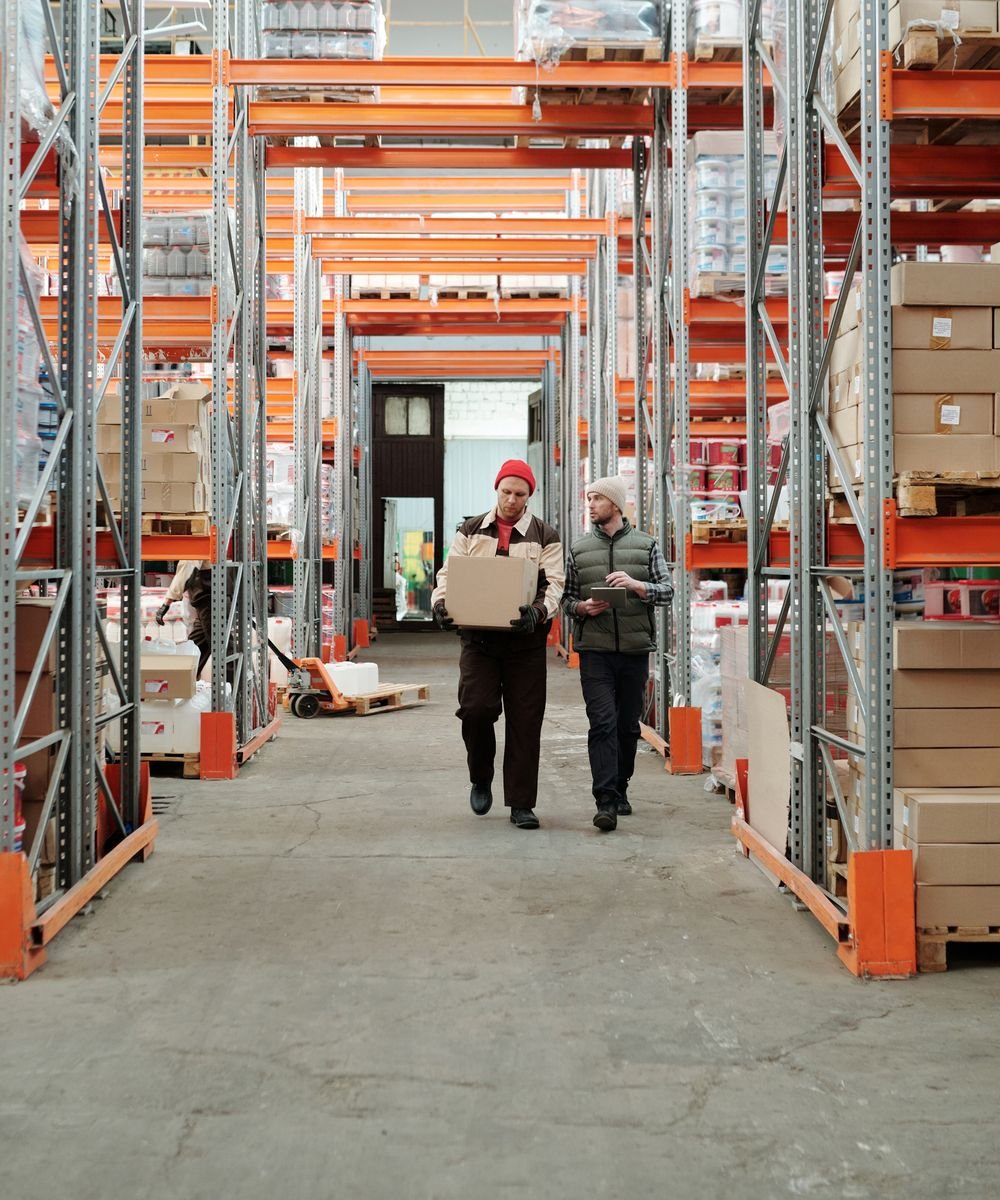 Warehouse team coordinating product packaging and dispatch for buyers